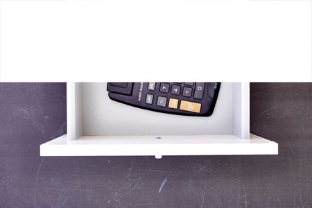 A studio photo of an electronic business calculatorの写真素材