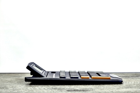 A studio photo of an electronic business calculatorの写真素材