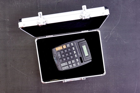 A studio photo of an electronic business calculatorの写真素材