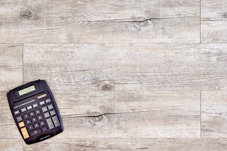 A studio photo of an electronic business calculatorの写真素材