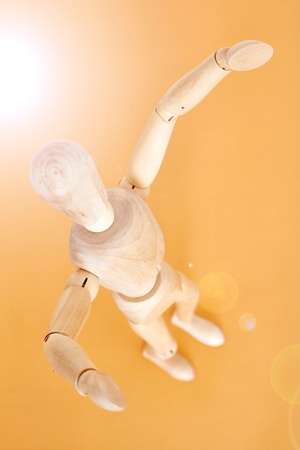 A studio photo of a wooden toy mannequinの写真素材