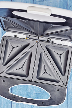 A studio photo of a sandwich toastie maker