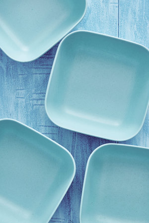 A studio photo of a matte finish square bowl