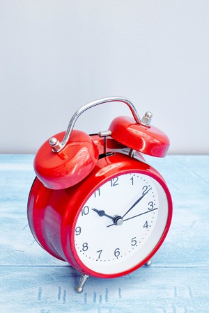 A studio photo of an alarm clockの写真素材