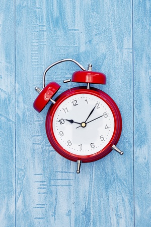 A studio photo of an alarm clockの写真素材