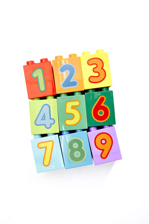A studio photo of toy block number