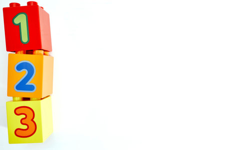 A studio photo of toy block number