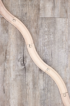 A studio photo of a wooden train trackの写真素材