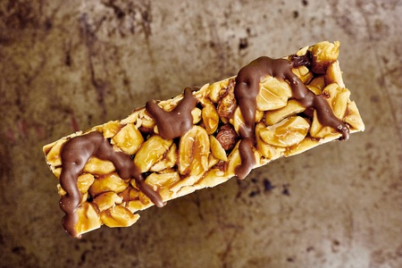 A studio photo of a choc coated nut barの写真素材