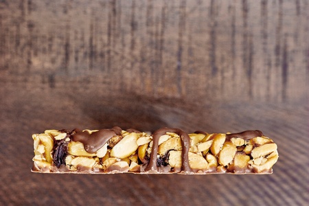 A studio photo of a choc coated nut barの写真素材
