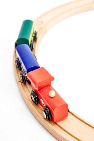 A studio photo of a wooden train trackの写真素材