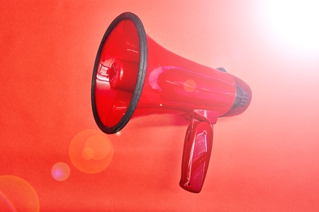 A studio photo of a red mega phoneの写真素材