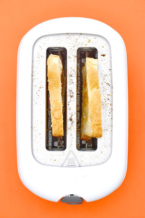 A studio photo of a white toaster