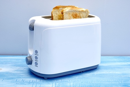 A studio photo of a white toasterの写真素材