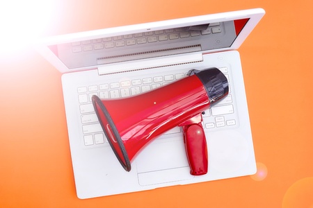 A studio photo of a red mega phoneの写真素材