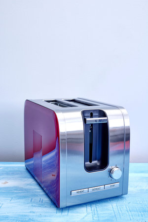 A studio photo of a white toaster