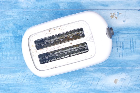 A studio photo of a white toasterの写真素材