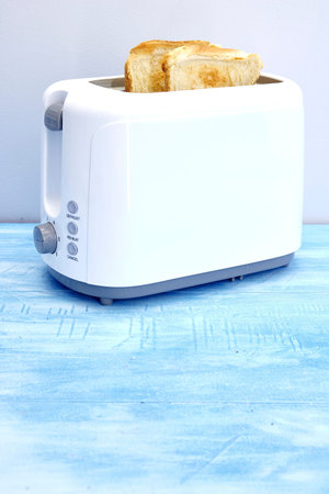 A studio photo of a white toasterの写真素材