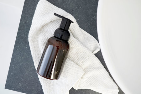 A studio photo of a soap dispenser