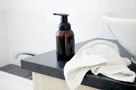 A studio photo of a soap dispenser