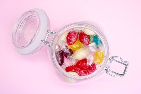 A studio photo of a jar of lolliesの写真素材