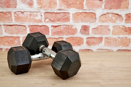 A studio photo of gym dumbellsの写真素材