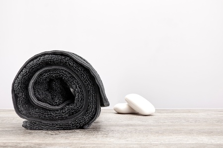 A studio photo of a black bathing towelの写真素材