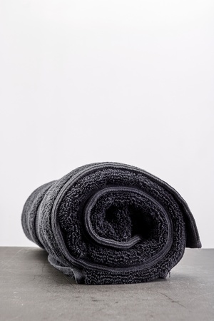 A studio photo of a black bathing towelの写真素材