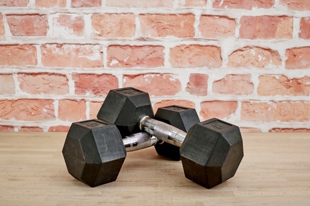 A studio photo of gym dumbellsの写真素材