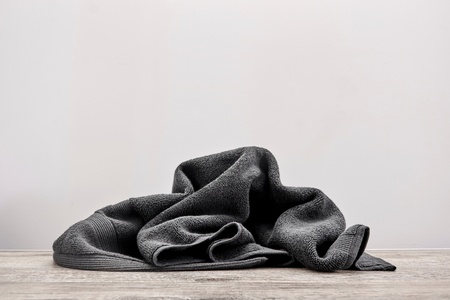A studio photo of a black bathing towelの写真素材