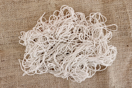 A studio photo of tangled string