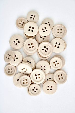 A studio photo of wooden buttons