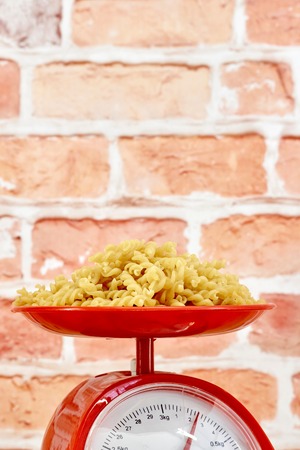 A studio photo of kitchen scalesの写真素材