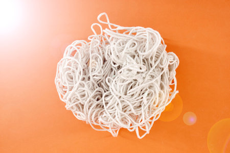A studio photo of tangled string