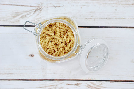 A studio photo of dry pasta noodles