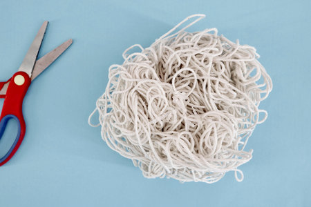A studio photo of tangled string
