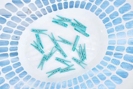 A studio photo of clothes line pegs