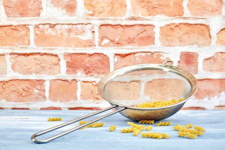 A studio photo of dry pasta noodlesの写真素材