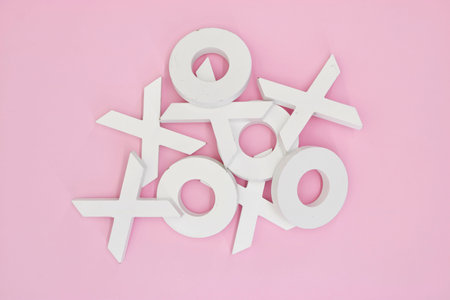 A studio photo of naughts and crosses