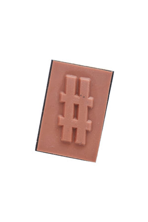 A studio photo of a wooden block hash tag