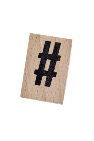 A studio photo of a wooden block hash tag
