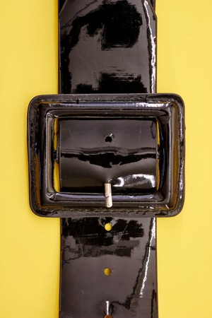 A studio photo of a black clothing beltの写真素材