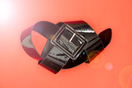 A studio photo of a black clothing beltの写真素材