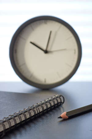 A studio photo of a desk clockの写真素材