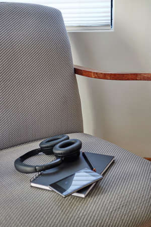 A studio photo of a mobile phone with headphonesの写真素材
