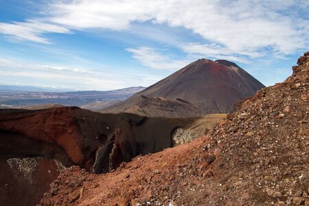 Landscape of red crater with volcano in the backround in new zealand north islandの写真素材