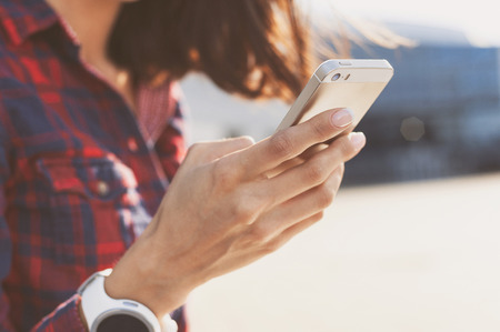 Woman using smartphone in the cityの写真素材