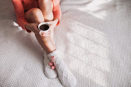 Woman holding cup of coffeeの写真素材