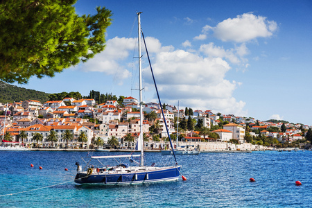 Sailing boat in a beautiful bay of the Hvar island, Dalmatia, Croatiaの写真素材