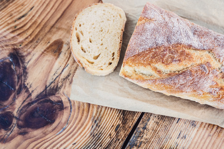 Bread on old rustic wooden table . Bakery, cooking and grocery store concept.の写真素材